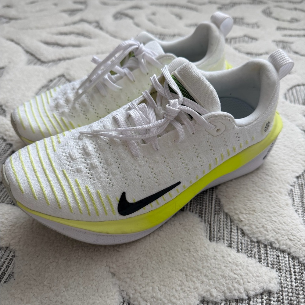 Nike InfinityRN 4 shoes in the white, black, and light lemon twist/volt